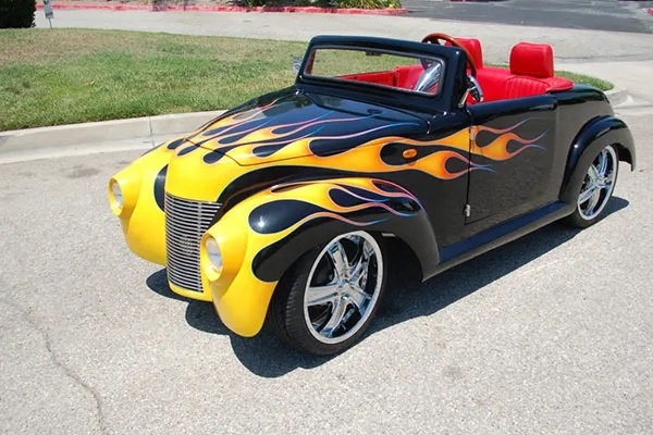 Black 39 Roadster with Yellow Flames affordable golf cart rental, golf cart rent miami