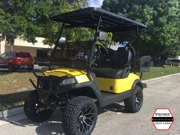Yellow Aluma 4 Passenger Lifted Golf Cart affordable golf cart rental, golf cart rent miami